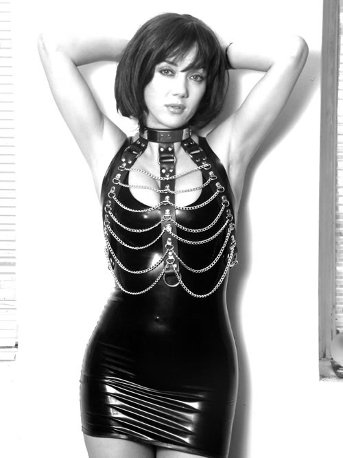 Young dominatrix in latex and chains