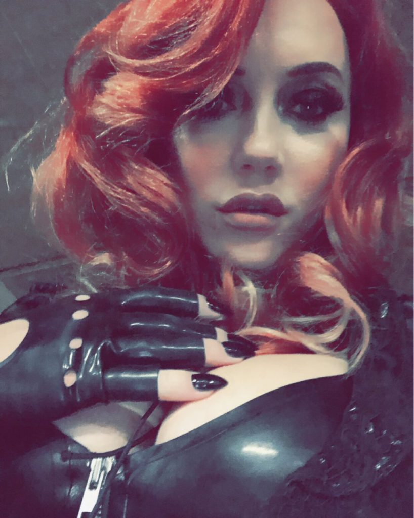 red head mistress in latex gloves